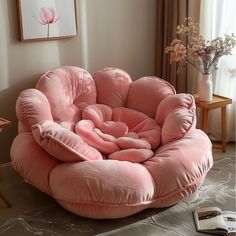 a pink bean bag chair in a living room