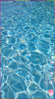 an empty swimming pool with clear blue water