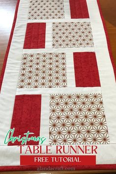 a table runner with red and white squares on it