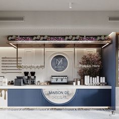 an ice cream shop with flowers on the counter and coffee machines in front of it