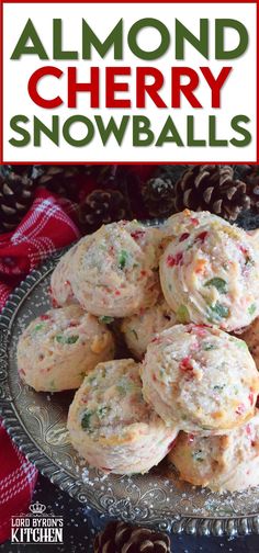 almond cherry snowballs on a plate with pine cones in the background and text overlay