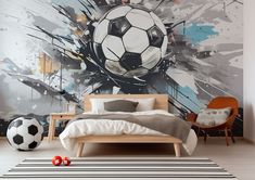 a bedroom with a soccer ball painted on the wall