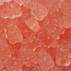 some pink gummy bears sitting on top of each other