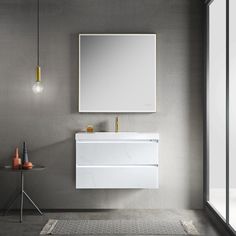 a white sink sitting under a bathroom mirror next to a wall mounted faucet