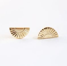 Apollonia Sunrays Stud Earrings Apollonia is a feminine variation of Apollo, Greek sun god. A perfect name for our stud earrings with a delicate sunrays design. READY TO SHIP in 14k yellow gold, pair.  See the matching Apollonia ring here.
See the matching Apollonia necklace here. DETAILS  Shape: Half moon Measurement: 3.70x6.70 mm  Material:  14k Gold: yellow, white, rose  18k Gold: yellow, white, rose  Other Metal: platinum   Customization Options This design can be made with gemstones of your Elegant Sunburst Earrings As A Gift, Greek Sun God, Greek Sun, Apollo Greek, Sun Earrings, Flawless Diamond, Sun God, Platinum Jewelry, Custom Earrings