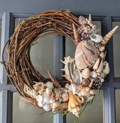 a wreath with seashells and shells on it