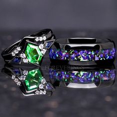 two rings with different colored stones and diamonds on the top one is green, the other is blue