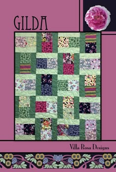 a pink flower sitting on top of a green and purple quilted wall hangings