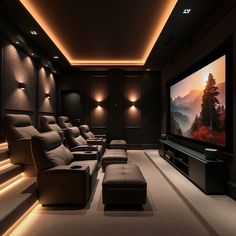 a home theater with two recliners and a large screen