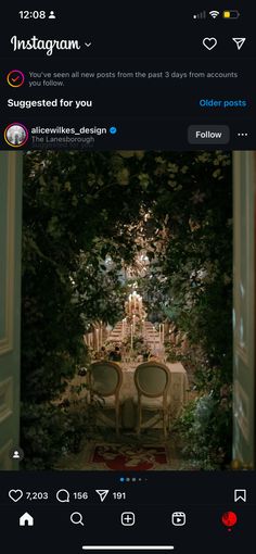 an instagram page with a table and chairs in the middle surrounded by greenery