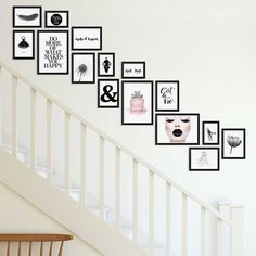 a stair case with pictures on the wall