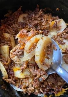 the food is prepared and ready to be eaten in the crock pot with spoon