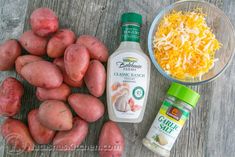 potatoes, cheese and seasoning on a wooden table