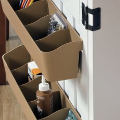 an organized drawer with two bins holding pens, pencils and other office supplies