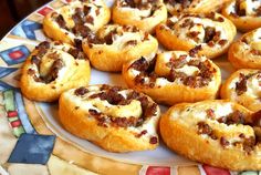 several pastries on a colorful plate sitting on a table