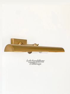 an image of a door handle on a white wall with the words lake shore home l's design