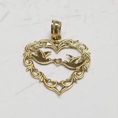 Thanks for shopping our vintage estate store. We tend to sell well below wholesale and truly hope you enjoy all of our items. Many of the items are one of a kind, so please enjoy scrolling through the pictures and hopefully something will catch your eye. Nice estate 14k yellow gold love birds heart filigree pendant. Just stunning. Size: 3/4" by 5/8" Weight: .68 gram Bail: 2mm Sweet pendant and marked 14k. Came from jewelry store that was closing. Antique Hallmark Jewelry For Valentine's Day, Ornate Gold Necklaces For Valentine's Day, Ornate Gold Jewelry For Valentine's Day, Ornate Gold Necklace For Valentine's Day, Ornate 14k Stamped Necklaces For Anniversary, Ornate Gold Jewelry With Heart Charm, Gold Jewelry With Hallmark For Wedding Gift, Vintage Double Heart 14k Gold Jewelry, Vintage 14k Gold Double Heart Jewelry