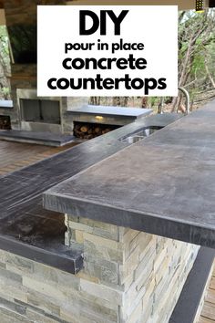 an outdoor kitchen with stone counter tops and grilling area in the background, text overlay reads diy pour in place concrete countertops