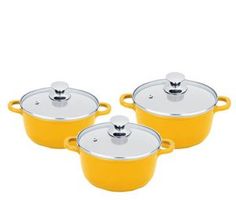 three yellow pots with lids and handles