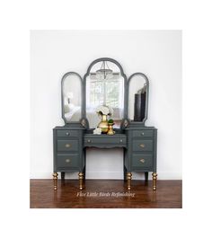 an antique vanity with mirror and gold accents