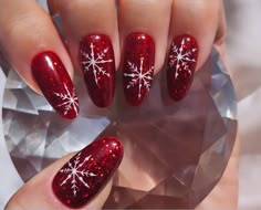 These beautiful hand drawn snowflakes lie on a red glittery gel that catches the light and flayed glistens from day to night.  These are made from Apres gel nails which are thicker and more durable than your average press on nails. They're easy to use and with proper care and removal can be used over and over again! These luxury press on nails will give you the perfect manicure within minutes. You receive- * Easy to follow instructions * 10 press on nails * Cuticle pusher * Nail buffer * Alcohol Stylish Nails Christmas, Red Winter Nails Design, Christmas Nail Designs Round, Red Snowflake Nails Almond, Red Sparkle Nails Acrylic Christmas, Sparkly Red Nails With Snowflake, Christmas Glitter French Tip Nails, Red Glitter Snowflake Nails, Red Nail With Snowflake