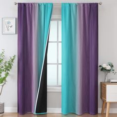 the curtains in this room are painted purple and teal with black stripes on them