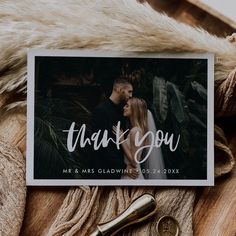 a wedding thank card with the words thank you on it