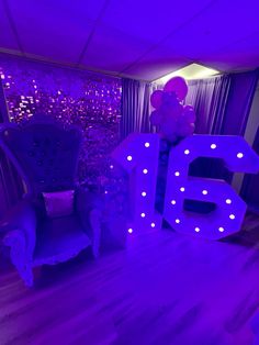 a purple room with the number 55 lit up