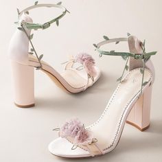 #BellaBelleByYou - Eden was designed, created, and voted by you in our first ever social collaboration campaign. It’s like wearing a beautiful garden of Eden on your feet. It is filled with lush layers of pastel-colored organza flowers in yellow, blush and lavender. The sandal silhouette, coupled with block heels make this shoe the perfect heel for a garden soiree . You can stay secure with the twirling embroidered vines that wrap around the ankle strap. Handmade, extra padding for all-day comfo Wedding Shoes With Flowers, New Heels Design 2023, Garden Party Heels, Fun Prom Shoes, Fairy Prom Shoes, Fancy Heels Aesthetic, Fantasy Wedding Shoes, Weeding Shoes For Girl, Shoes For Quince