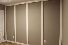 an empty room with sliding doors in the corner and carpet on the floor next to it