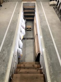 the stairs are lined up with bags of items on them and ready to be shipped