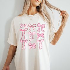 Handmade -This funny Unisex 'Dog Mom' tee is real life and inspirational, it's sure to be a hit! This would be the best gift for a special person in your life! Made with the softest trendy tees we all love! -This shirt is the perfect addition to anyone's wardrobe! Pairs great with leggings, jeans, and shorts as it can be dressed up or down! Its the perfect everyday look that everyone will love! -This updated irresistibly soft unisex tee essentially fits like a well-loved favorite featuring a uni Casual Short Sleeve T-shirt With Pink Bow, Cute Bow T-shirt For Spring, Summer T-shirt With Bow And Short Sleeves, Cute Pink T-shirt With Bow, Summer Bow T-shirt With Short Sleeves, Summer Short Sleeve T-shirt With Bow, Summer Bow Detail Short Sleeve T-shirt, Summer Crew Neck T-shirt With Bow, Trendy White Tops With Bow Print