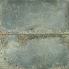 an old, rusty metal plate with rust on the edges and paint chippings