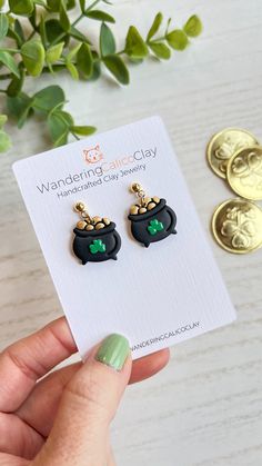 Capture the charm of St. Patrick's Day with these delightful pot of gold earrings, meticulously handcrafted from clay. Each pair features a miniature pot overflowing with gold coins, symbolizing luck, prosperity, and the thrill of a leprechaun's treasure.  Made from high-quality polymer clay, these earrings are lightweight and comfortable to wear throughout the day. Each earring is handmade lead and cadmium free 18K gold plated brass posts. Wandering Calico Clay earrings are styled and cut by ha Gold Clay Earrings, Miniature Pot, St Patrick's Day Outfit, St Patrick's Day Gifts, Saint Patrick's Day, Pot Of Gold, Gifts For My Wife, St Pattys Day, Saint Patrick