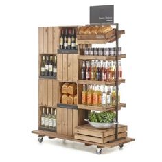 an image of a food cart with wine and bread on it's shelves for sale