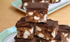 several pieces of chocolate and marshmallow squares on a plate