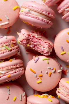 pink macaroons with white and yellow sprinkles