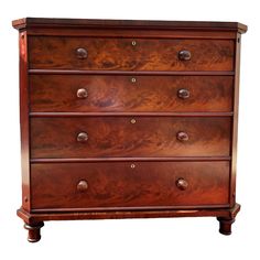 a wooden dresser with four drawers and knobs