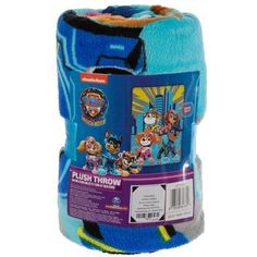 the paw patrol plush throw blanket is blue and has yellow, orange, and purple stripes