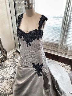 a dress on display in front of a window