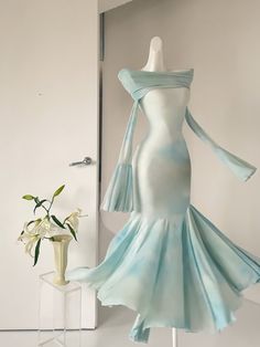 This enchanting dress features an elegant off-shoulder fold-over neckline, adding a touch of sophistication to any occasion. The fabric is adorned with delicate floral patterns, beautifully blending shades of blue and green for a refreshing and graceful look. The mermaid silhouette is expertly crafted with curved tailoring, allowing the skirt to flow gracefully with every step, exuding an air of refined elegance.  Please note that the price includes one dress only.   	 		 			Size 			XS 			S 			M Mermaid Dress Pattern, Little Mermaid Dresses, Steampunk Fashion Female, Enchanting Dress, Gothic Skirts, Drawings Ideas, Puff Dress, Fishtail Dress, Mermaid Skirt