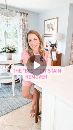 a woman standing in front of a kitchen counter with the words, the best diy stain remover