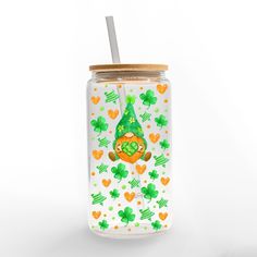 Add a lucky touch to your barware this St. Patrick's Day season with this festive glass can cup. Designed and printed in the United States on quality materials, this is an item you're sure to love. Enjoy your favorite beverage in this glass can cup with a bamboo top and glass straw designed in the USA. 16-ounce capacity Dimensions: 3x3x5.8 Reuseable glass can cup with a bamboo top and a trendy glass straw Great for daily use of iced beverages Hand wash only Irish Gnome, Iced Beverages, Fete Saint Patrick, 16oz Glass Can, Bamboo Top, Creative Products, Iced Drinks, Glass Straws, Saint Patrick