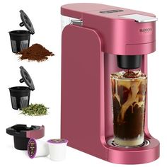 a pink coffee maker with three cups and spices