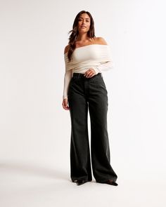 Our Curve Love high rise wide leg jeans in a saturated black wash with a clean hem. This fit features a 10.5” high rise, is relaxed at the waist and hips, and eases into a wide, full-length leg shape. The viral fit that eliminates waist gap: Curve Love features additional room through the hip and thigh for curve-hugging comfort. This jean is made from our super light drapey denim fabric, which features a super soft lightweight rigid denim. High Rise Wide Leg Jeans, Lululemon Tops, Bralette Tops, Suit Accessories, New Arrival Dress, Swimwear Accessories, Denim Fabric, Wide Leg Jeans, Jacket Tops