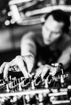 a man that is playing some kind of music on a keyboard in black and white