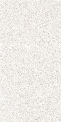 a white textured wallpaper with small dots