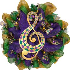 a purple and green wreath with a musical note