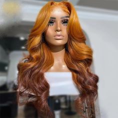 a mannequin's head with long red hair