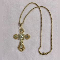 Beautiful Statement Piece, Gothic Cross Pendant Embedded With Sparkling Cubic Zirconia Gemstones On A Stainless Steel 316l Rope Chain. *Chain Length: 50cm Or 60cm.(Let Me Know Which One Would You Like (- : *Chain Material: Stainless Steel. *Cross Pendant Length:75cm *Cross Material: Zinc Alloy And Crystals. Will Ship Next Day Or Same Day If Possible. #Bigcross #Crystaljewelry #Rosarynecklace #Crossnecklace #Grungenecklace Tags: Gothic Cross Necklace Handmade Jewelry Handmade Necklace Crystal Jew Crystal Cross Chain Jewelry, Crystal Cross Jewelry With Chain, Gold Gothic Jewelry With Adjustable Chain, Gothic Gold Necklace With Adjustable Chain, Gothic Gold Jewelry With Adjustable Chain, Gothic Gold Cross Pendant Jewelry, Gothic Gold Chain Jewelry, Gold Crystal Rhinestone Cross Pendant Necklace, Metal Cross Pendant Necklace With Rhinestones